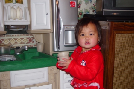 Kasen cooking in her kitchen